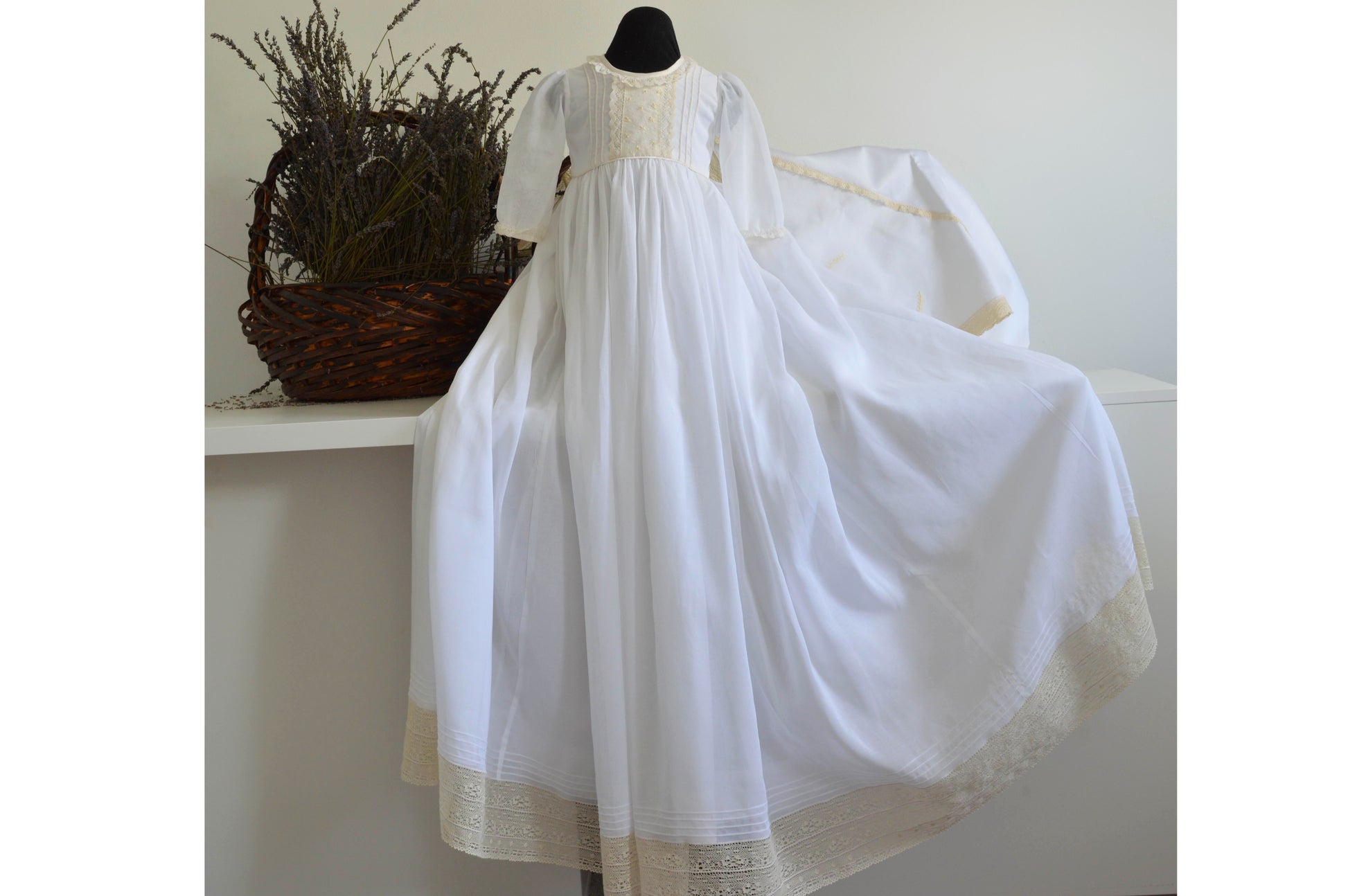 Christening Gown, Cathedral length in snowy white trimmed with beautiful French lace, pin tucks, and bullion rose buds. 