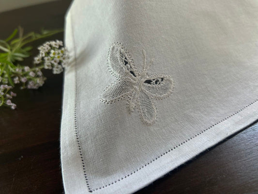  Cocktail Napkin , white cotton showcasing the fine handmade butterfly.