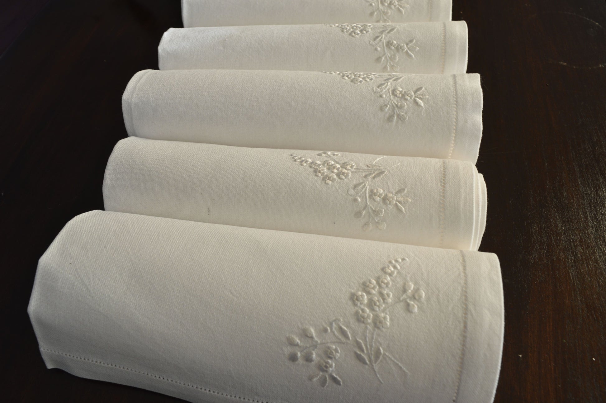 Elegant White cotton  dinner napkins embellished with fine hand embroidery work. 